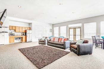 Community clubhouse with kitchenette and lounge seating